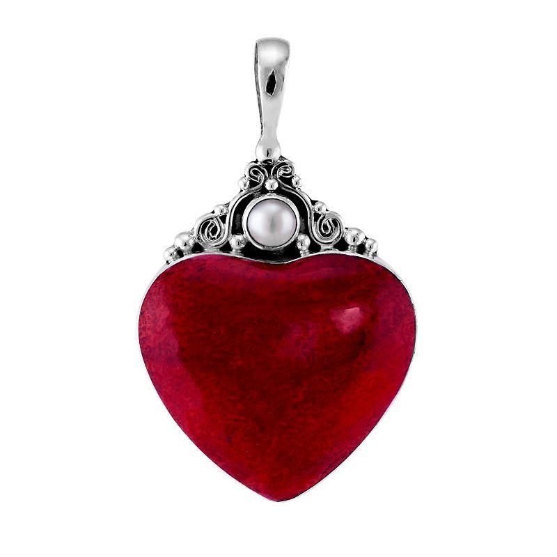 Handcrafted sterling silver heart pendant with vibrant red coral centerpiece and luminous Mother of Pearl accent, artisan Bali jewelry for timeless elegance.