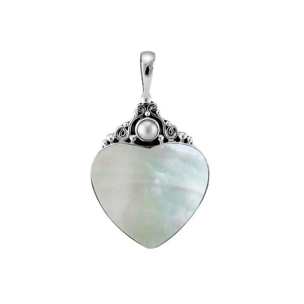 Handcrafted sterling silver heart pendant with luminous Mother of Pearl centerpiece and delicate Balinese scrollwork, artisan jewelry for timeless elegance.