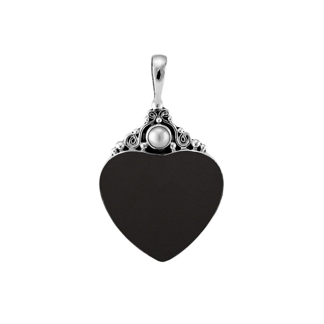 Handcrafted sterling silver heart pendant with glossy black shell and luminous Mother of Pearl accent, artisan Bali jewelry for timeless elegance.