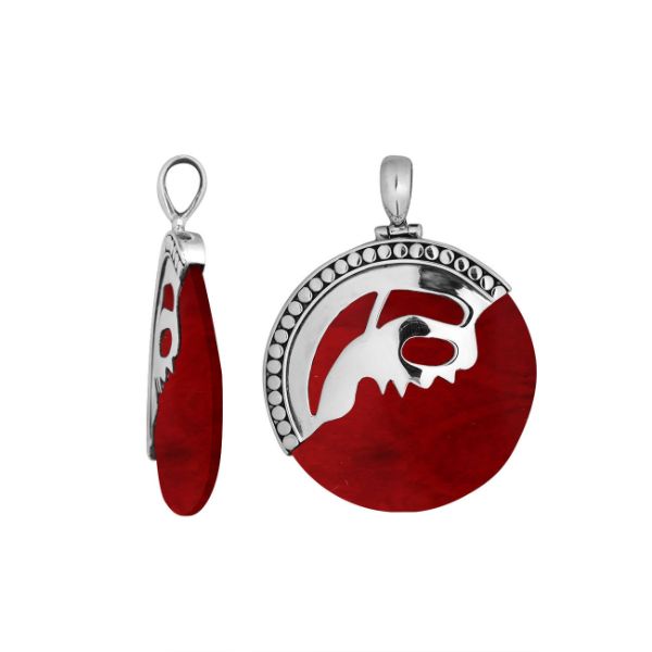 Handcrafted sterling silver round pendant with vibrant red coral inlay and unique silver overlay design, artisan Bali jewelry for bold everyday style. 