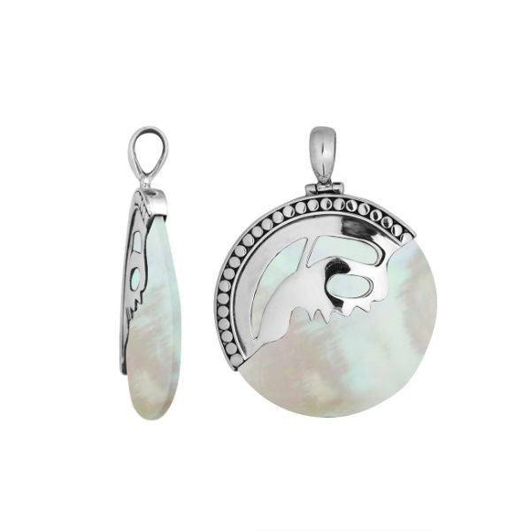Handcrafted sterling silver round pendant with luminous Mother of Pearl inlay and unique silver overlay design, artisan Bali jewelry for timeless elegance.