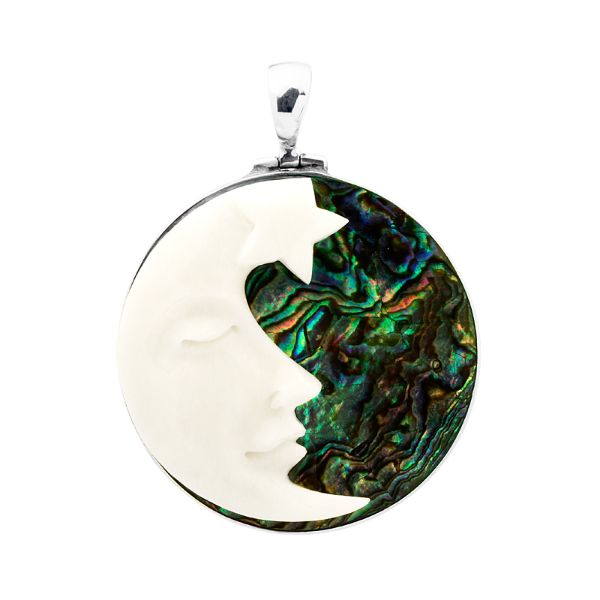 Handcrafted sterling silver round pendant with carved bone face and shimmering abalone shell inlay, artisan Bali jewelry with unique spiritual design.