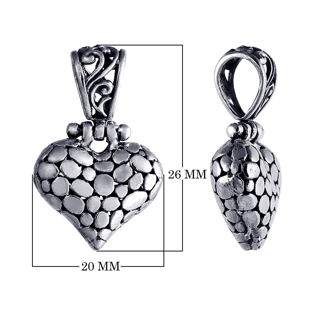 Handcrafted sterling silver heart pendant with textured detailing and ornate Balinese design, a timeless symbol of love and artisan jewelry for women.