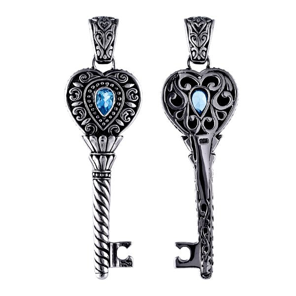 Sterling silver heart key pendant with genuine blue topaz gemstone and detailed Balinese scrollwork, handcrafted artisan jewelry for gifting or everyday wear.