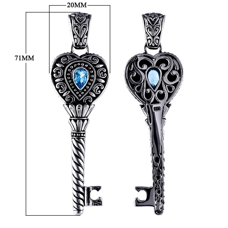 Sterling silver heart key pendant with genuine blue topaz gemstone and detailed Balinese scrollwork, handcrafted artisan jewelry for gifting or everyday wear.