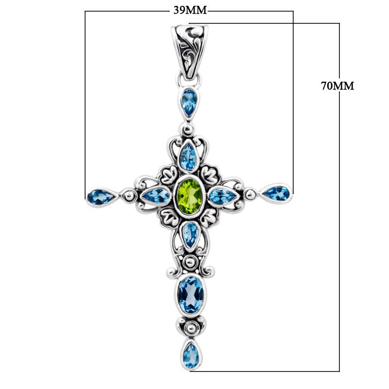 Sterling silver cross pendant with vibrant peridot center and sparkling blue topaz accents, handcrafted Balinese jewelry for faith-inspired style and gifting.