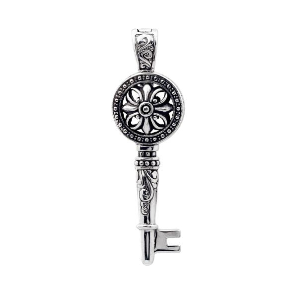 Sterling silver key pendant with handcrafted Bali floral design – symbolic jewelry gift of love, luck, and new beginnings