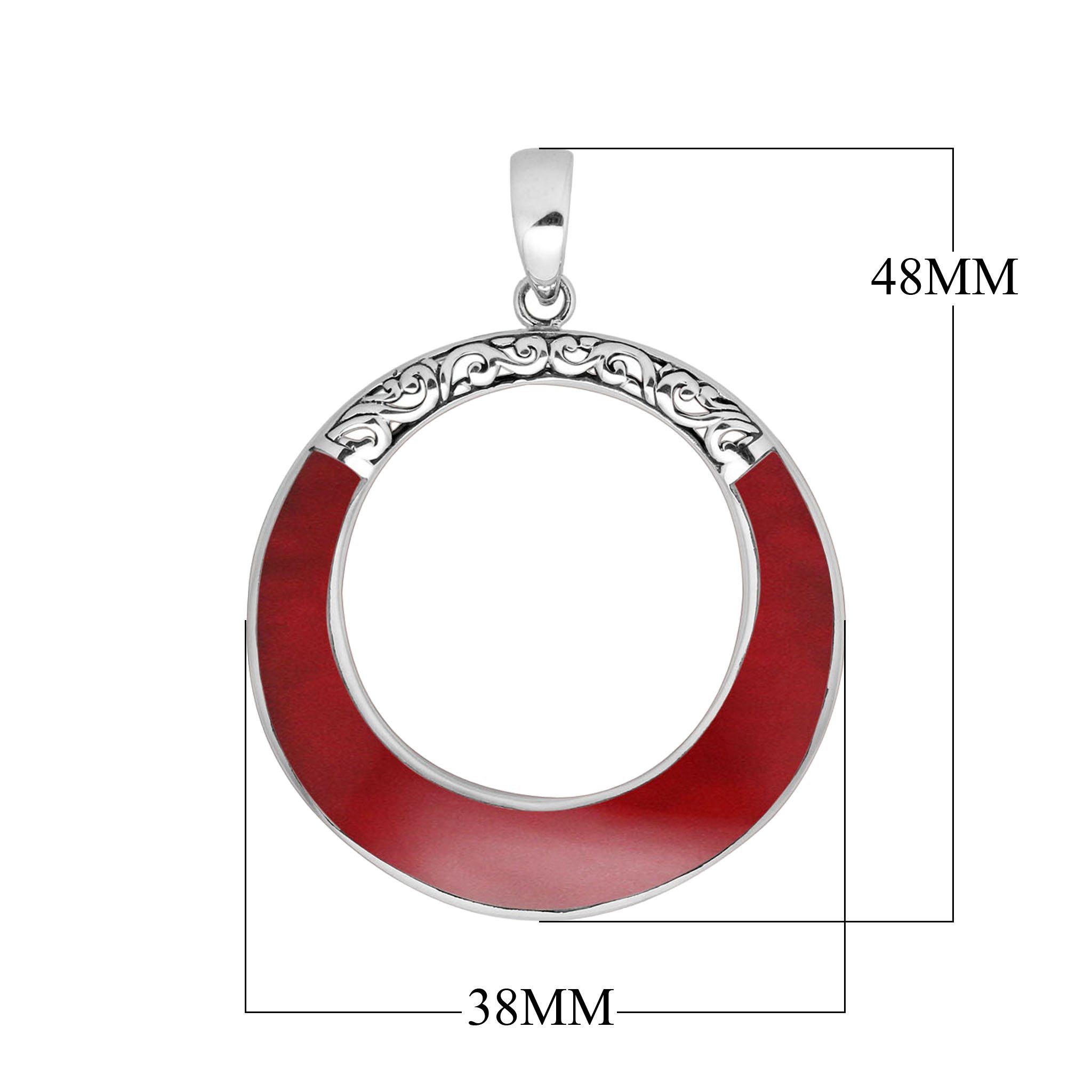 Round red coral pendant in sterling silver with open circle design and ornate detailing, handcrafted artisan jewelry