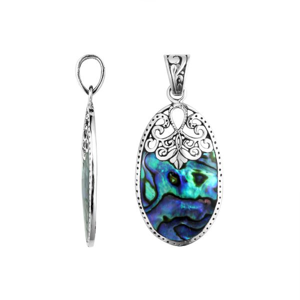 Sterling silver oval pendant with shimmering abalone shell inlay and delicate Balinese filigree detail, handcrafted in Bali.
