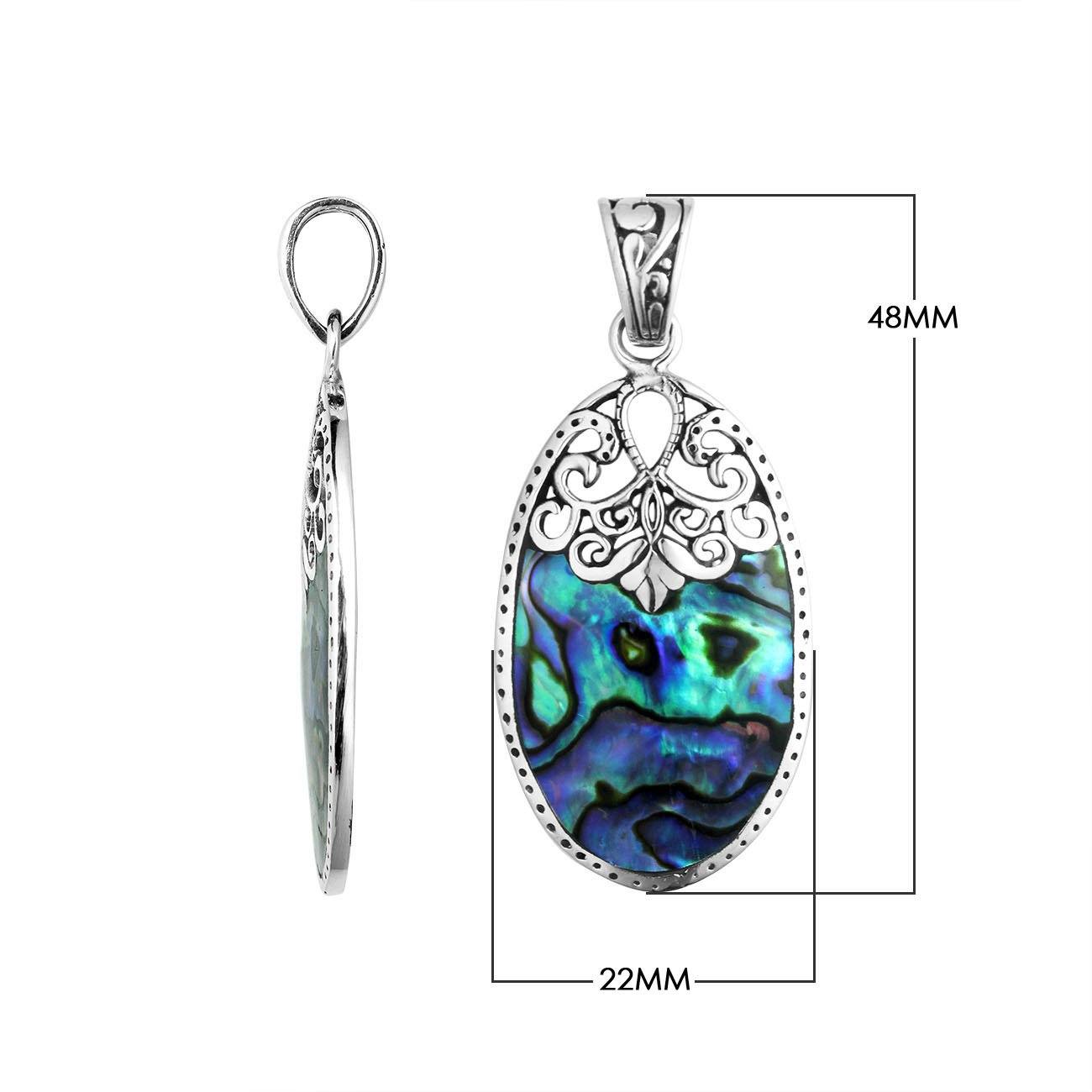 Sterling silver oval pendant with shimmering abalone shell inlay and delicate Balinese filigree detail, handcrafted in Bali.