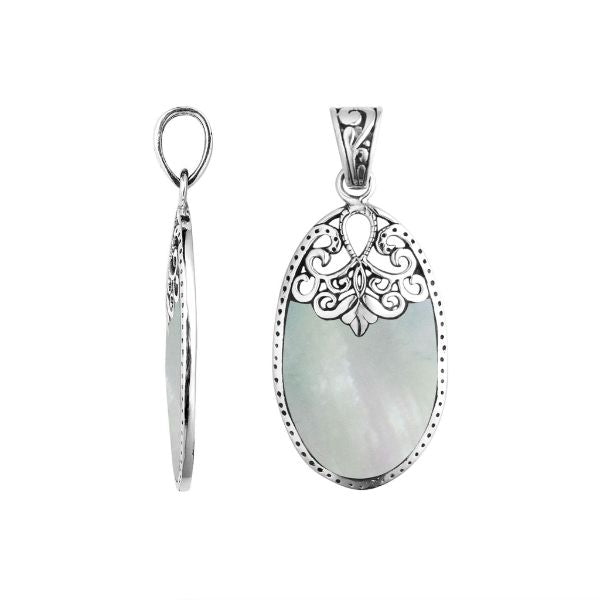 Sterling silver oval pendant with luminous Mother of Pearl inlay and delicate Balinese filigree design, handcrafted in Bali.