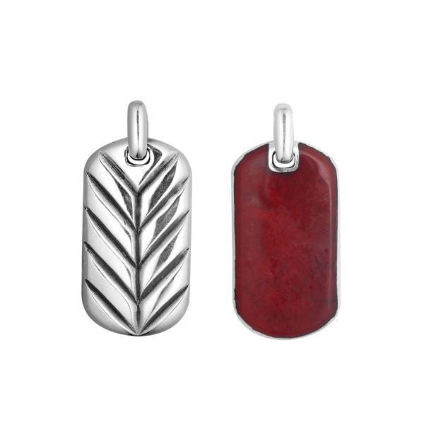 Sterling silver dog tag pendant with bold red coral inlay and reversible chevron silver design, handcrafted in Bali.