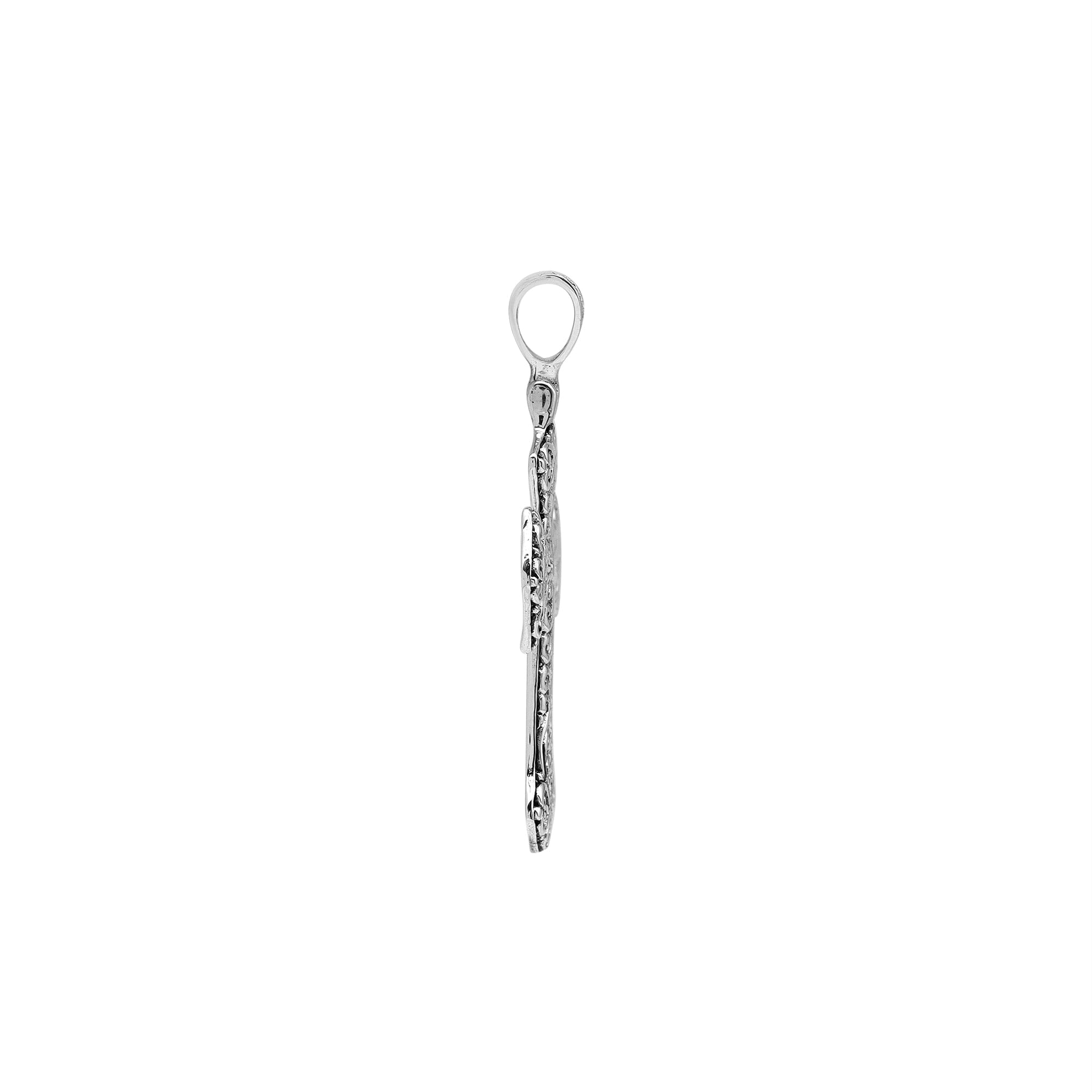 Sterling silver cross pendant with detailed scrollwork and oxidized accents, handcrafted Bali artisan jewelry for elegant spiritual style.