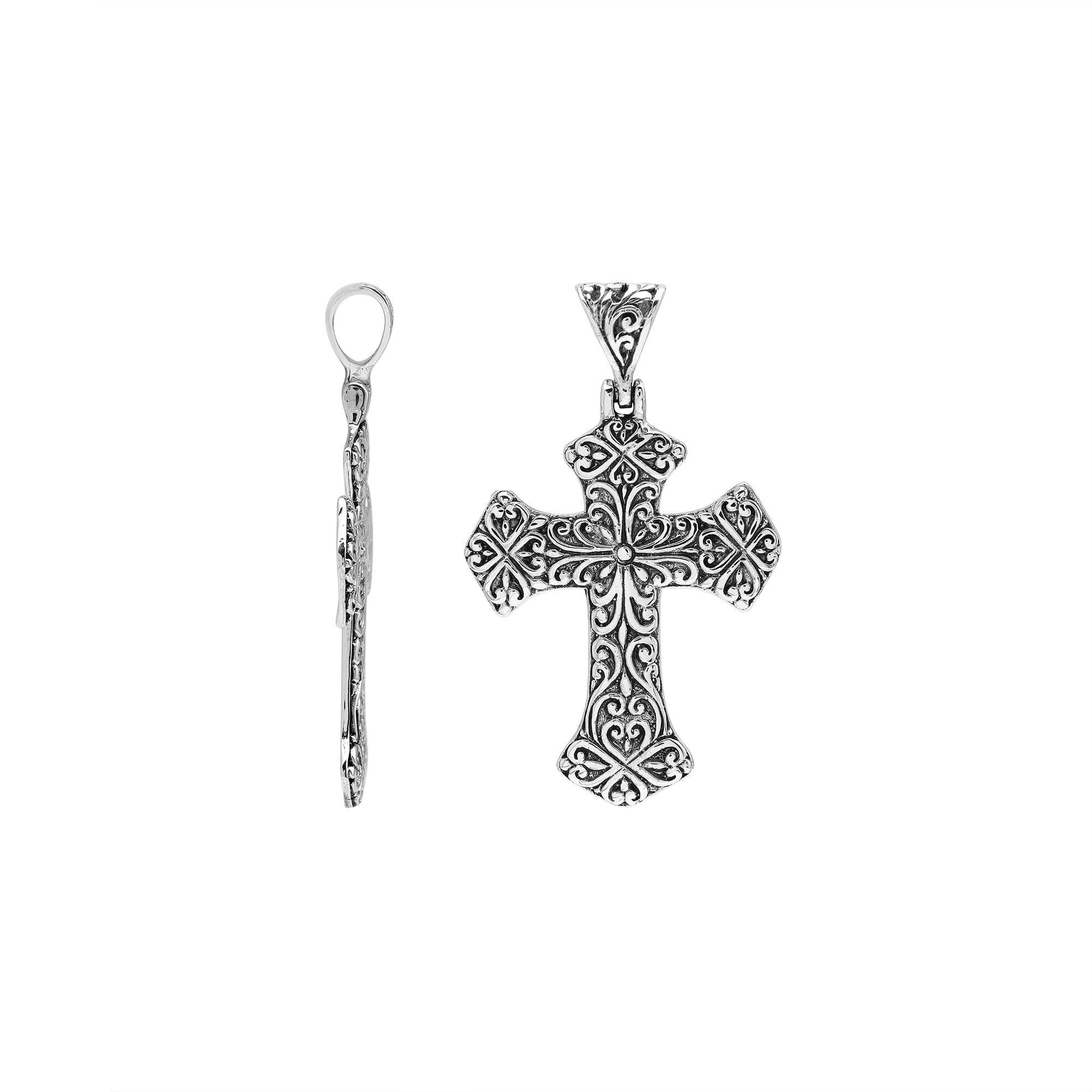 Sterling silver cross pendant with detailed scrollwork and oxidized accents, handcrafted Bali artisan jewelry for elegant spiritual style.
