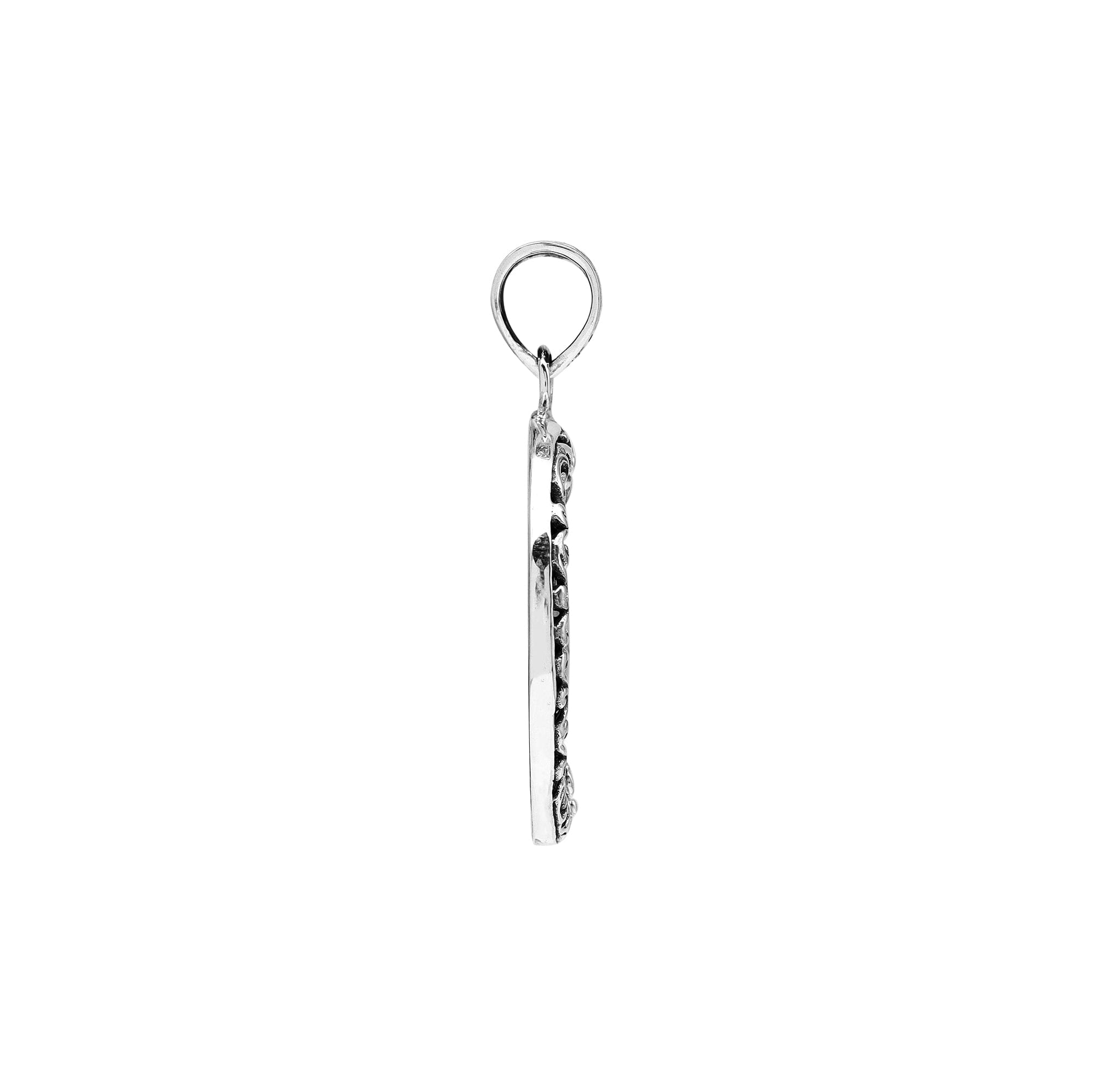 Sterling silver round pendant with glossy black shell and floral Bali detailing, handcrafted artisan jewelry for elegant everyday wear.