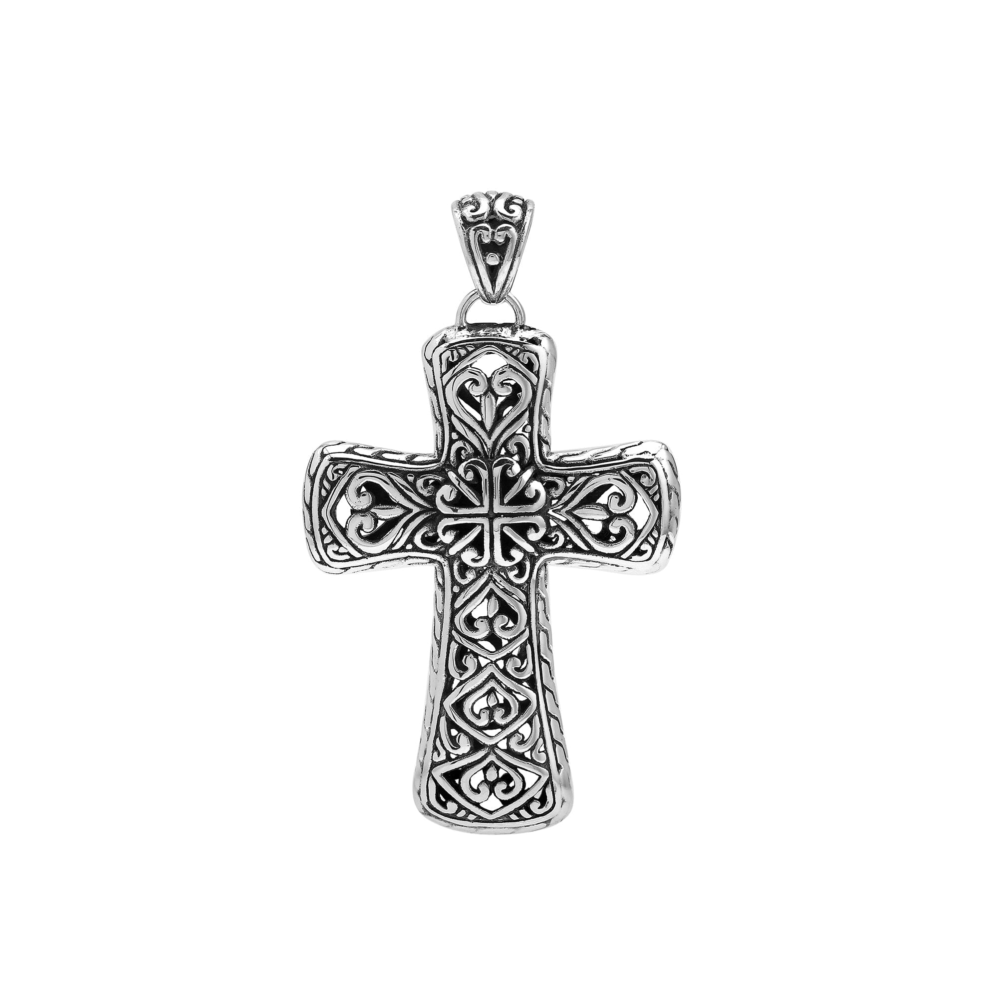 Handcrafted sterling silver ornate cross pendant with detailed Balinese scrollwork, elegant artisan jewelry for women.