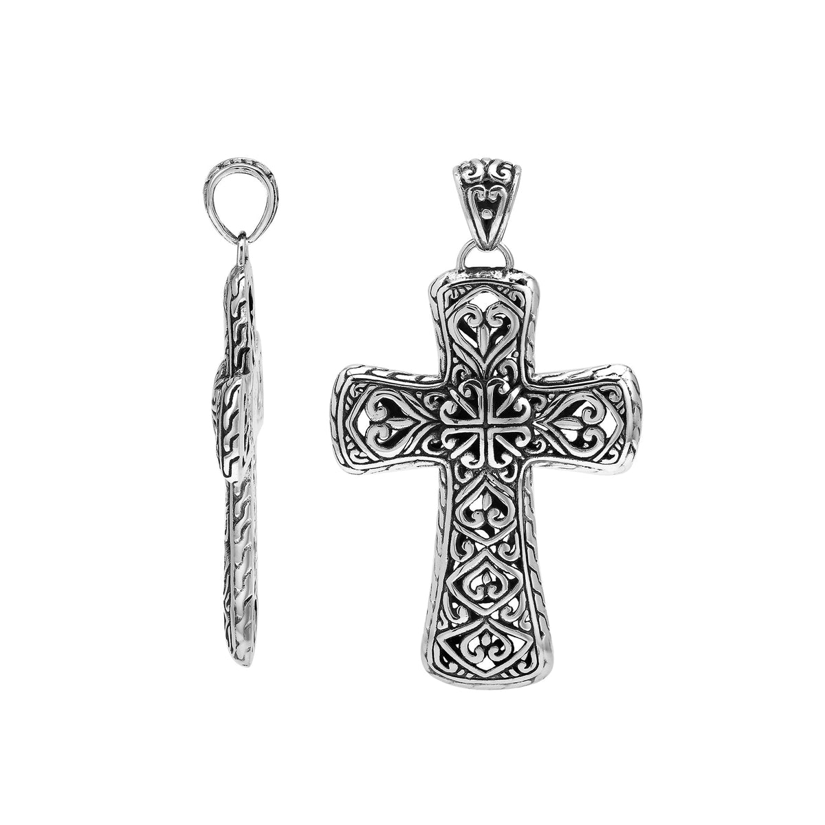 Handcrafted sterling silver ornate cross pendant with detailed Balinese scrollwork, elegant artisan jewelry for women.