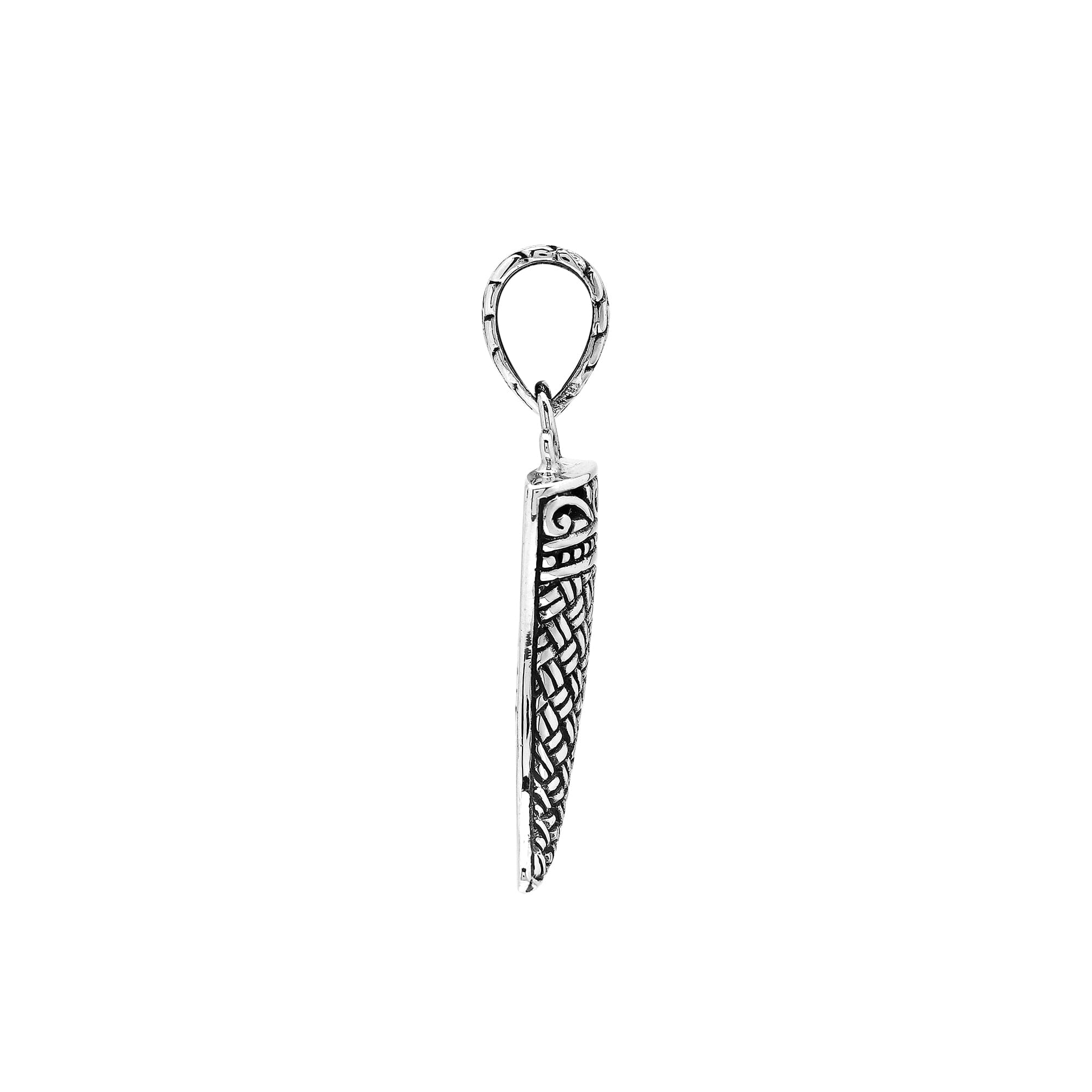 Handmade sterling silver tribal tooth pendant with detailed Balinese engravings, bold artisan men’s jewelry from Bali.