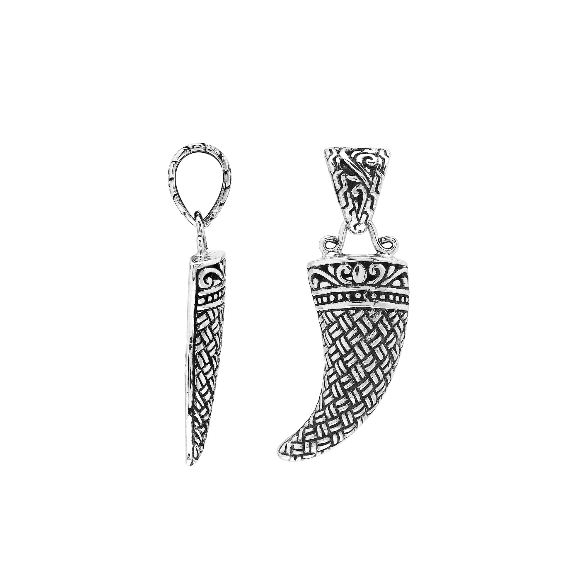 Handmade sterling silver tribal tooth pendant with detailed Balinese engravings, bold artisan men’s jewelry from Bali.