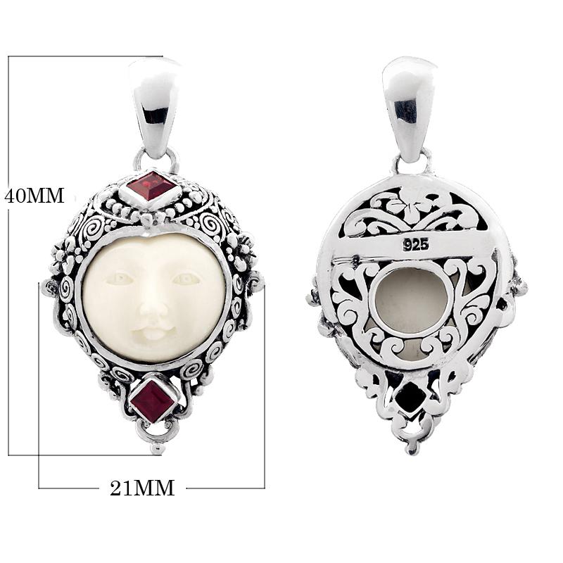 Handcrafted sterling silver pendant with Garnet Quartz accents and carved bone face, Bali-inspired jewelry.