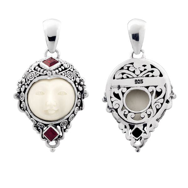 Handcrafted sterling silver pendant with Garnet Quartz accents and carved bone face, Bali-inspired jewelry.