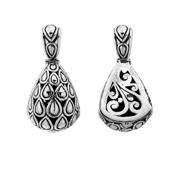 Handmade sterling silver pendant featuring teardrop droplet design on front and swirl carvings on back, Bali jewelry.