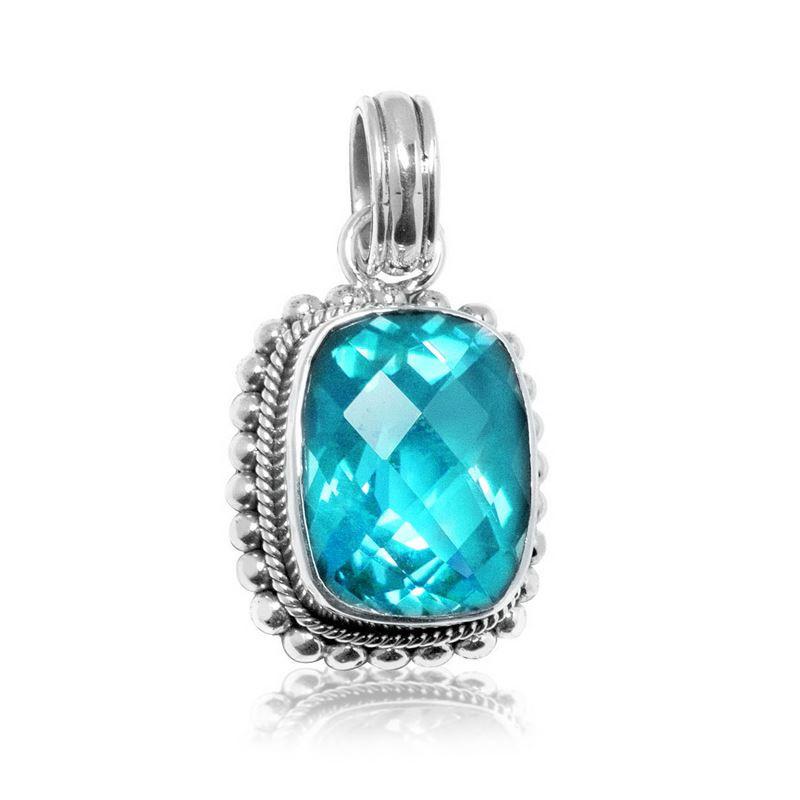 Handmade sterling silver pendant with cushion-cut Blue Topaz Quartz, artisan crafted in Bali