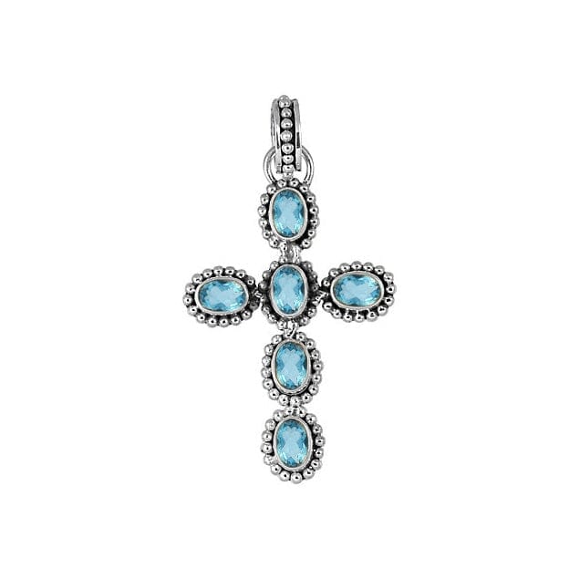 Elegant sterling silver cross pendant with faceted blue topaz quartz, handcrafted in Bali