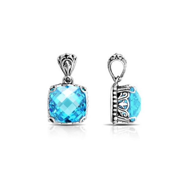 Sterling silver pendant with sparkling cushion-cut blue topaz quartz, Balinese handcrafted with scroll and bead detailing.