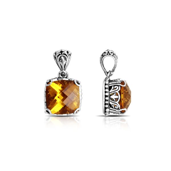 Sterling silver pendant with golden cushion-cut citrine quartz, Balinese handcrafted with bead and scroll detailing.