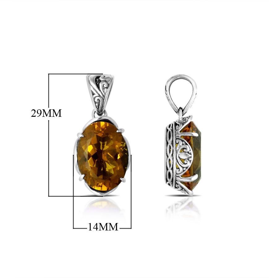 Sterling silver pendant with golden oval-cut citrine quartz, Balinese handcrafted with carved sides and oxidized finish.