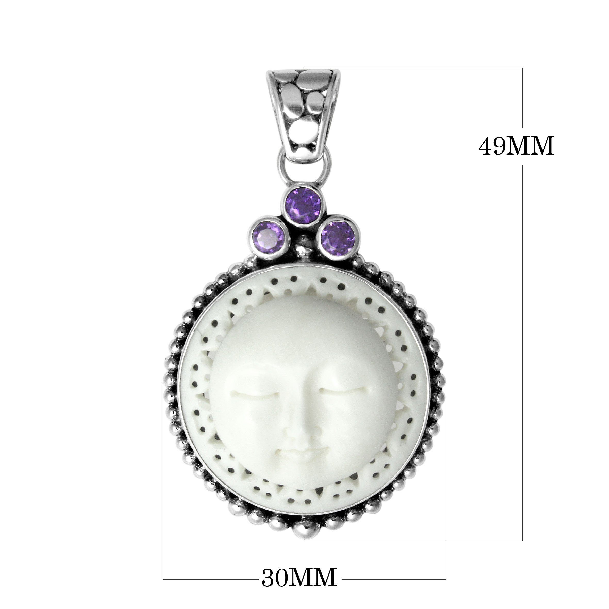 Handmade sterling silver Balinese pendant with carved bone moon face and Amethyst Quartz accents.