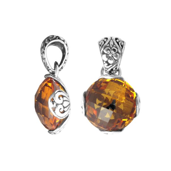Handmade sterling silver pendant with faceted Citrine Quartz and Balinese floral swirl details, artisan crafted in Bali.