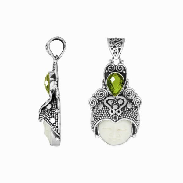Balinese bone face pendant with peridot quartz in sterling silver, handcrafted jewelry.