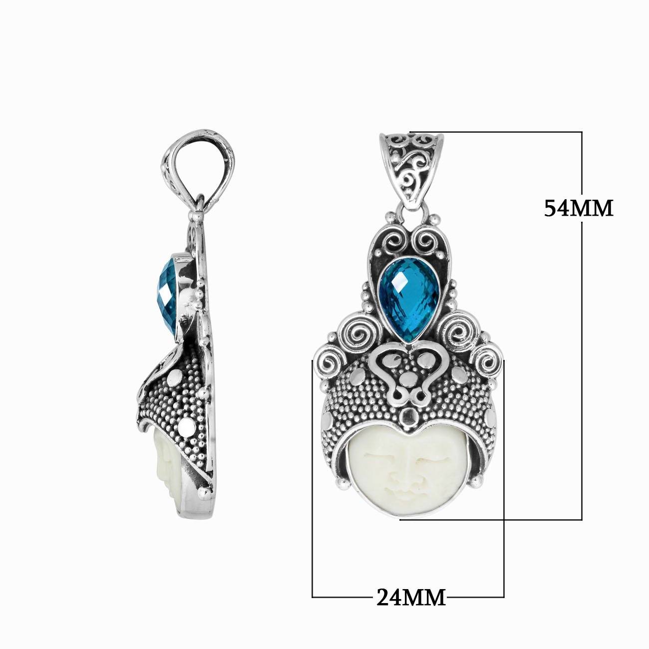 Balinese bone face pendant with blue topaz quartz in sterling silver, handcrafted jewelry.