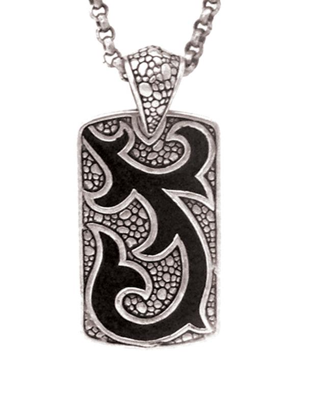 Artistic sterling silver rectangle pendant with tribal carved detailing.