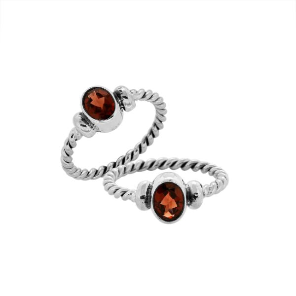 Sterling silver twisted band ring with oval faceted Garnet Quartz, artisan handcrafted jewelry for women, elegant red Quartz accessory.
