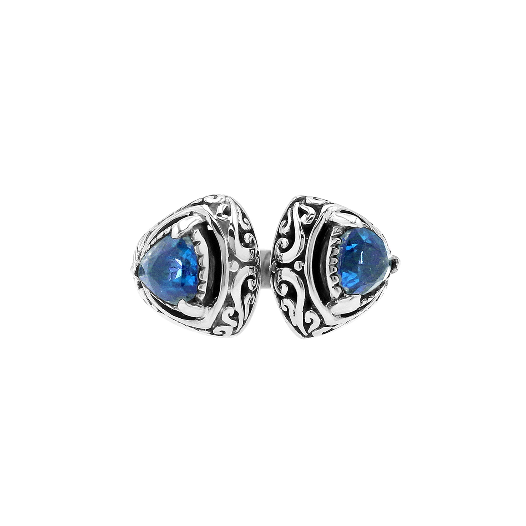 Sterling silver Bali scrollwork ring with trillion-cut Blue Topaz Quartz – artisan handcrafted statement jewelry for women.