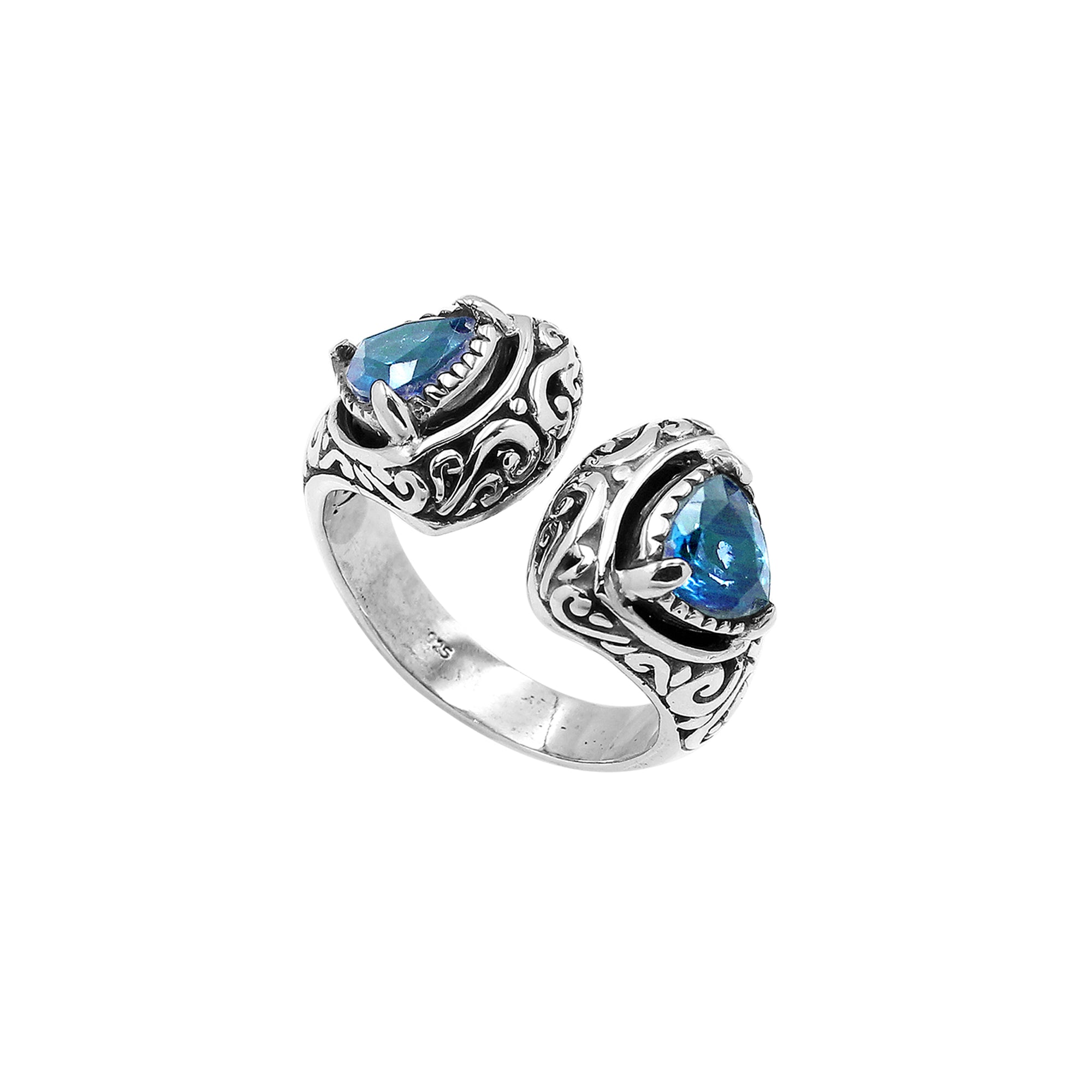 Sterling silver Bali scrollwork ring with trillion-cut Blue Topaz Quartz – artisan handcrafted statement jewelry for women.