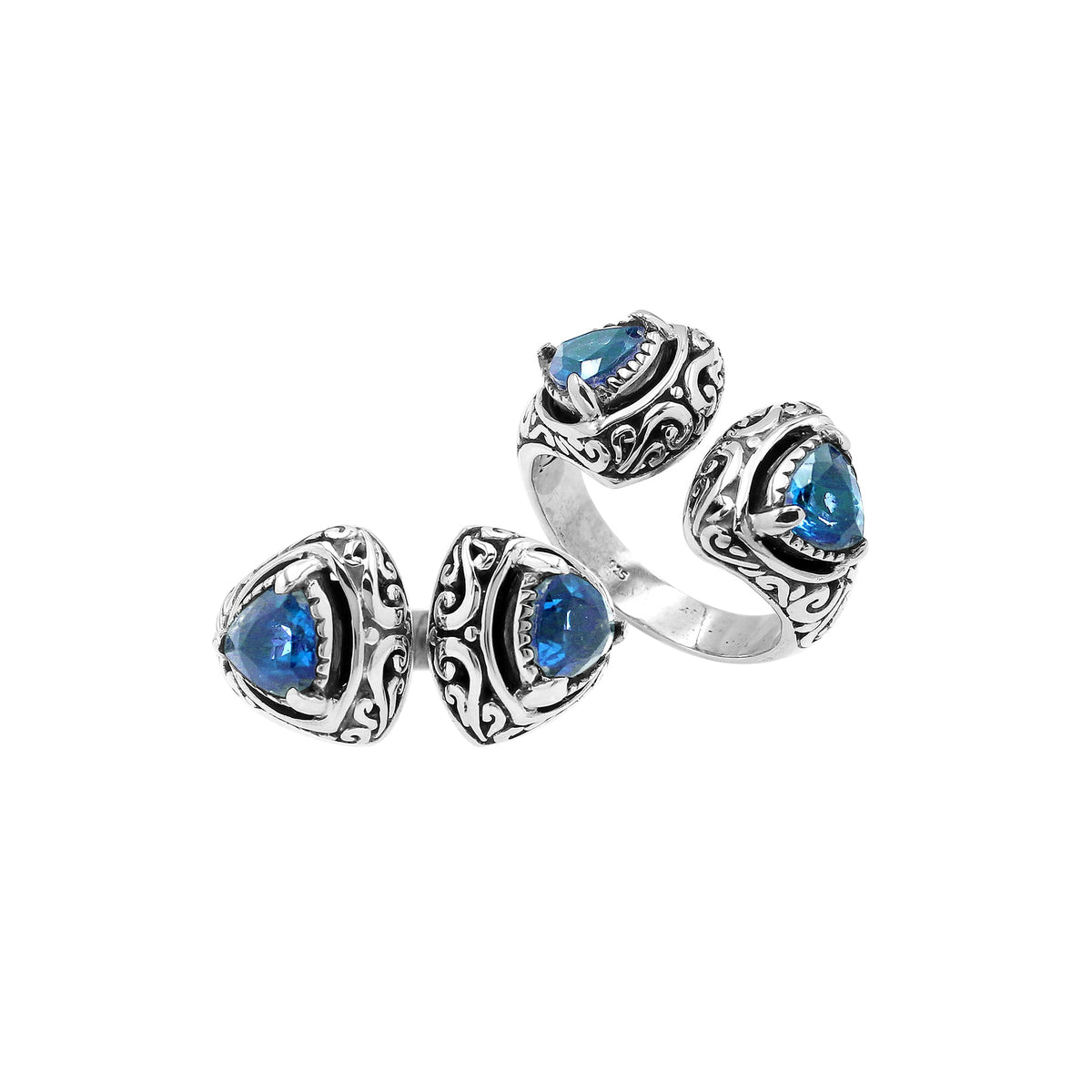 Sterling silver Bali scrollwork ring with trillion-cut Blue Topaz Quartz – artisan handcrafted statement jewelry for women.