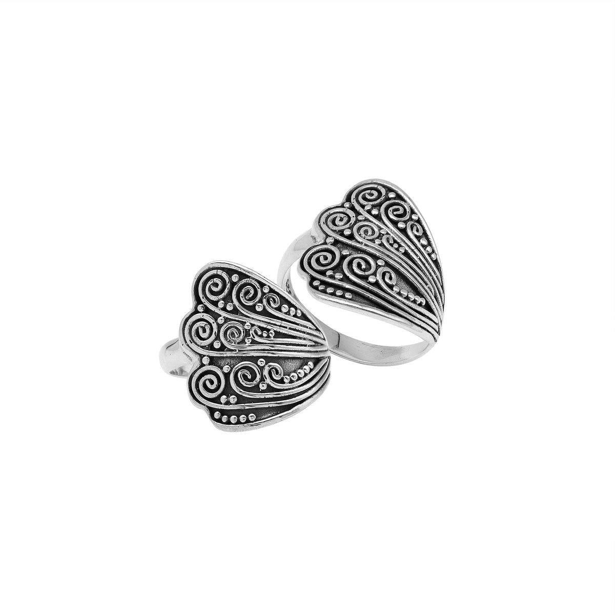 Sterling silver adjustable ring with elegant Balinese swirl and dot design, handcrafted artisan jewelry for everyday style.