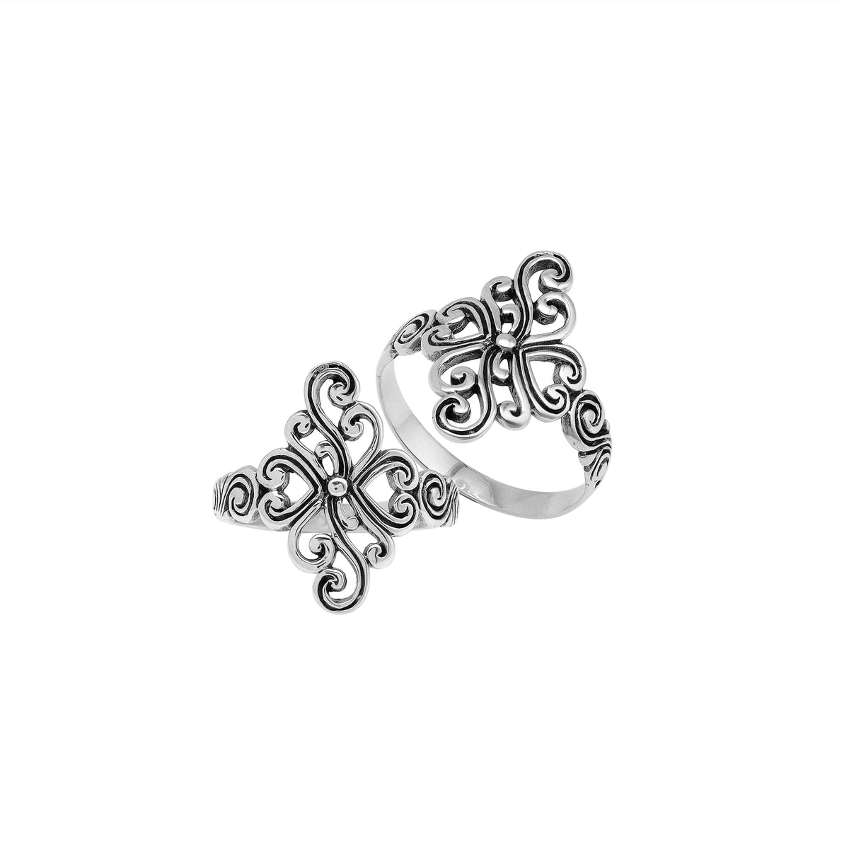 Sterling silver adjustable ring with elegant floral swirl design, handcrafted Balinese artisan jewelry for everyday wear.
