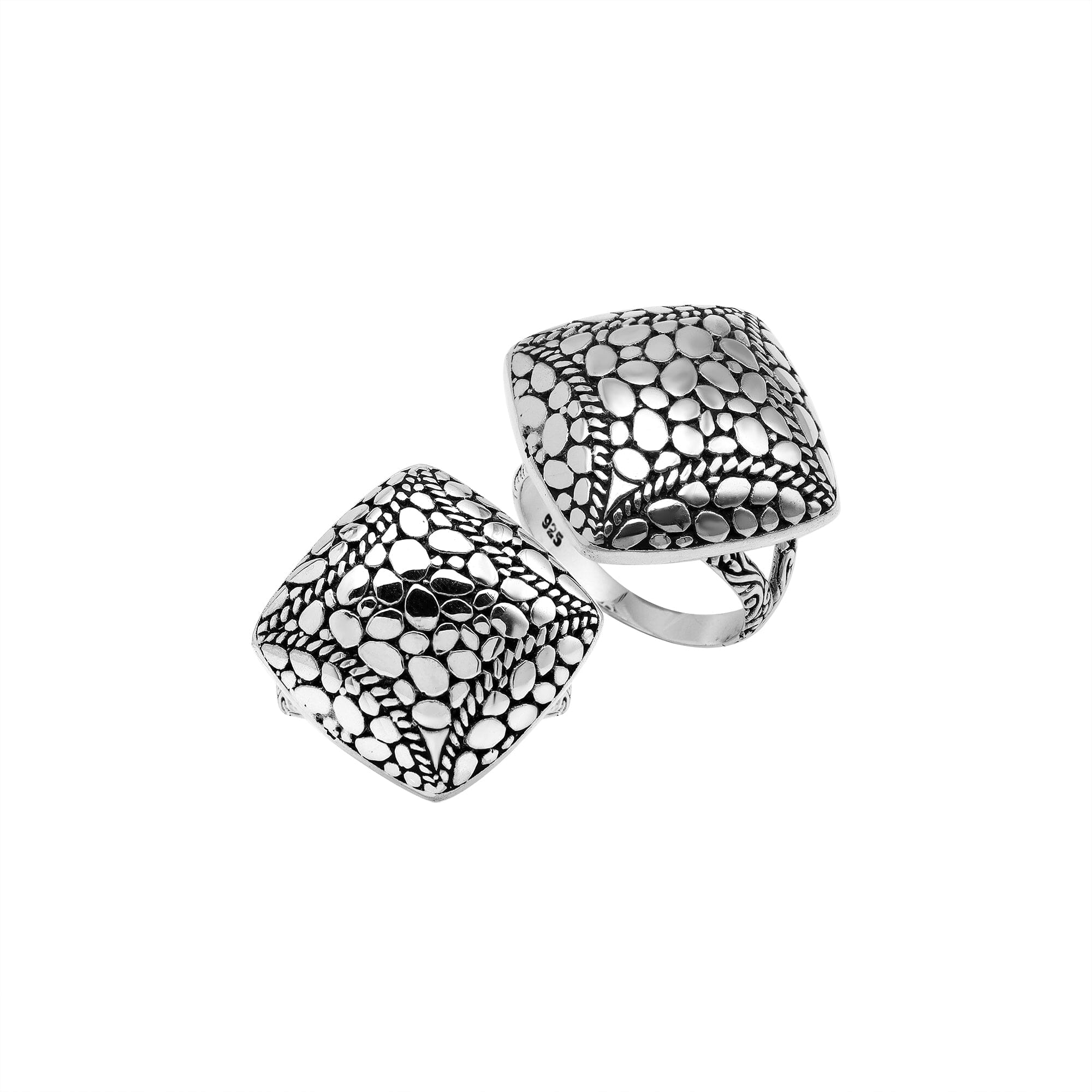 Sterling silver cushion dome ring with intricate Balinese dot design, handcrafted artisan statement jewelry.