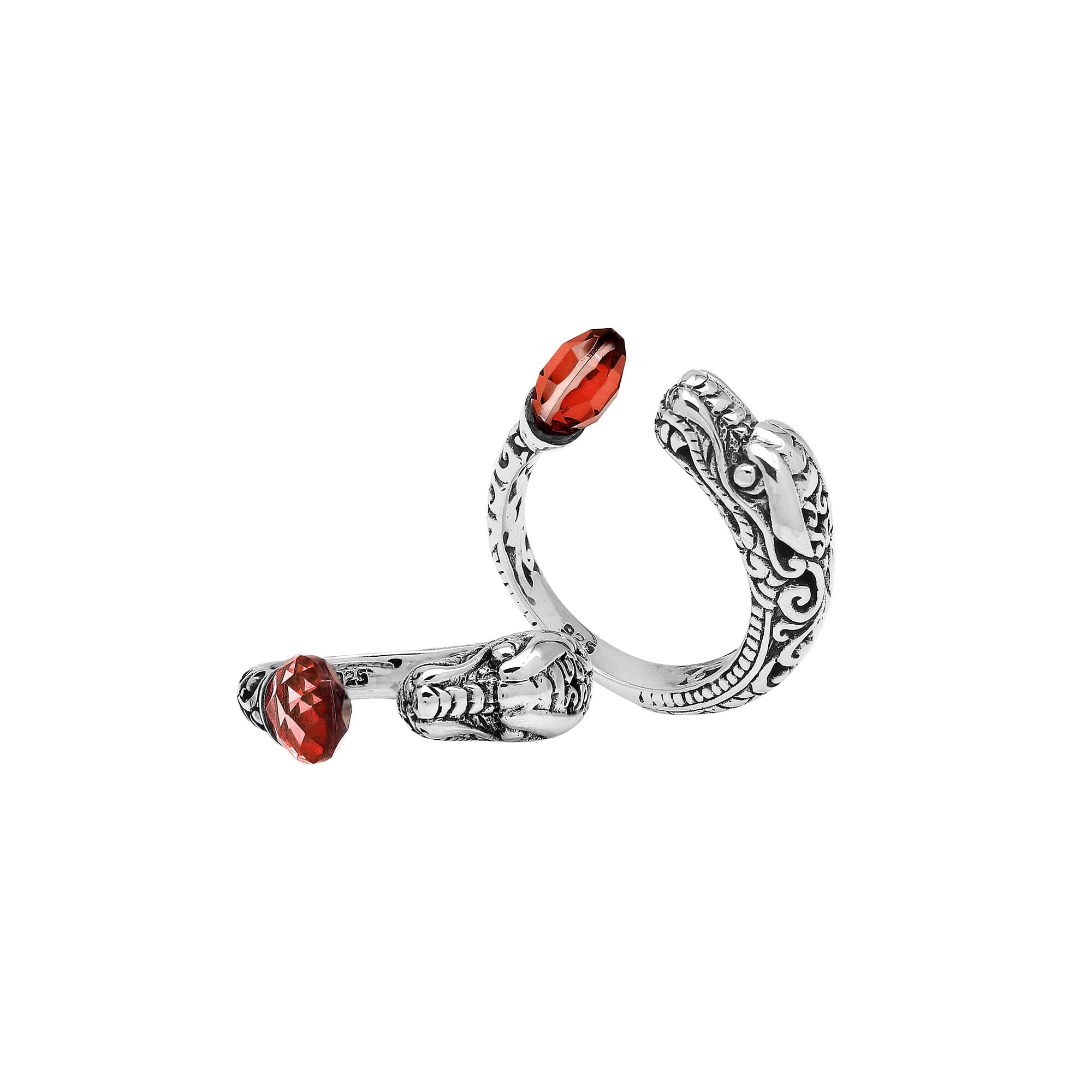 Handcrafted sterling silver dragon ring with two faceted Garnet Quartz, detailed Balinese carvings, and a bold bypass design.