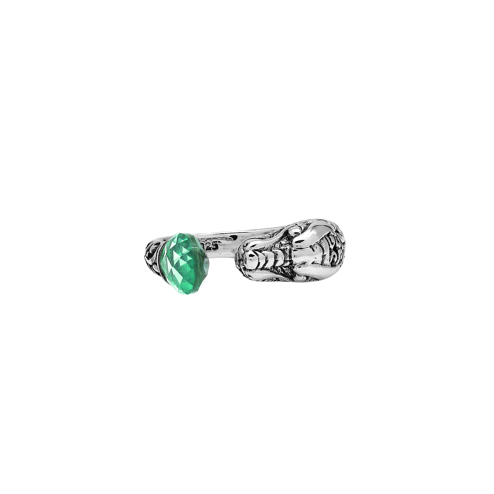 Handcrafted sterling silver dragon ring with Green Quartz accents, detailed Balinese carvings, and adjustable open band design for unique artisan style.