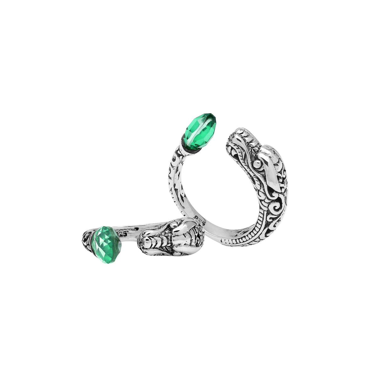 Handcrafted sterling silver dragon ring with Green Quartz accents, detailed Balinese carvings, and adjustable open band design for unique artisan style.