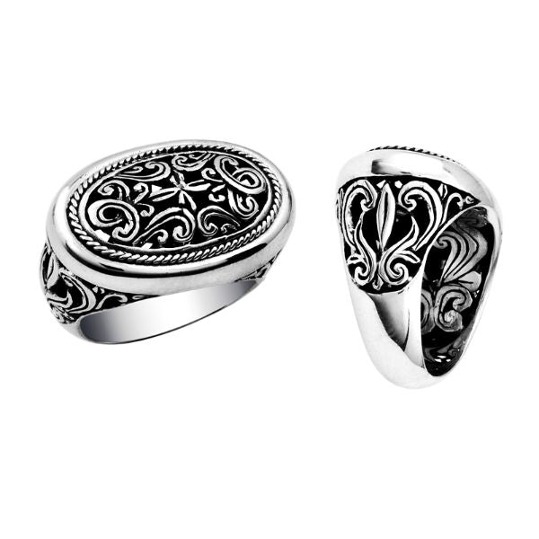 Woman sterling silver oval ring with intricate Bali carving and oxidized details, handcrafted 925 silver statement jewelry.