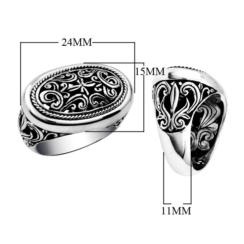 Woman sterling silver oval ring with intricate Bali carving and oxidized details, handcrafted 925 silver statement jewelry.