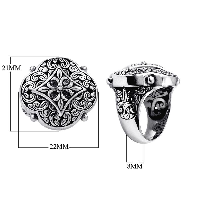 Handcrafted sterling silver Balinese statement ring with ornate floral medallion, detailed scrollwork, and oxidized finish for a bold artisan look.