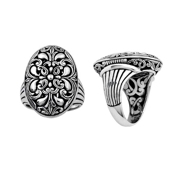 Handcrafted sterling silver oval floral ring with Balinese scroll detailing and oxidized finish, elegant artisan statement jewelry.